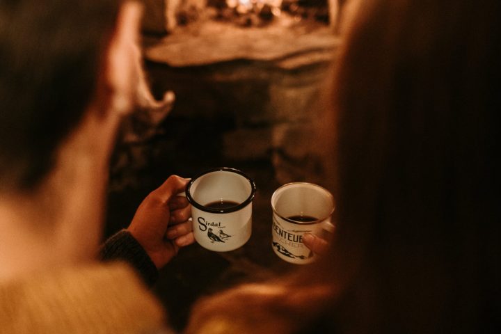 a close up of a person drinking from a cup