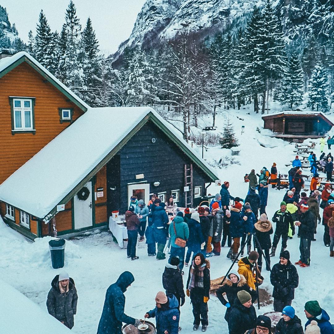 a group of people standing on the snow