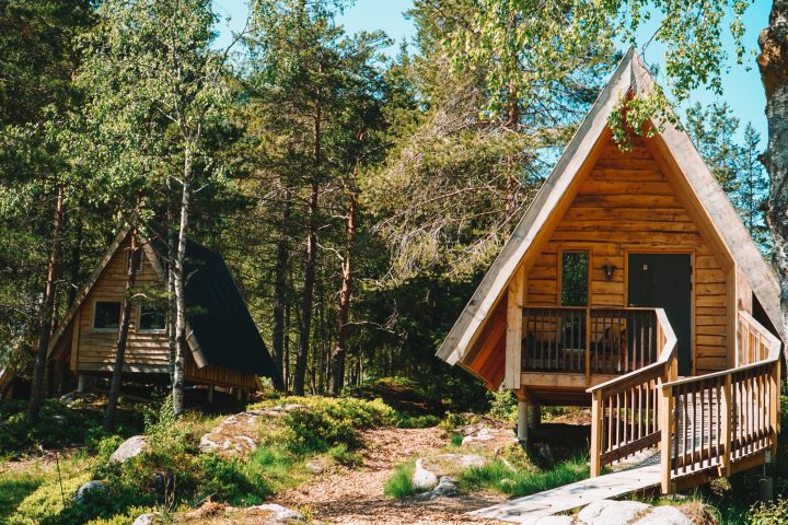 a wooden bench in front of a house