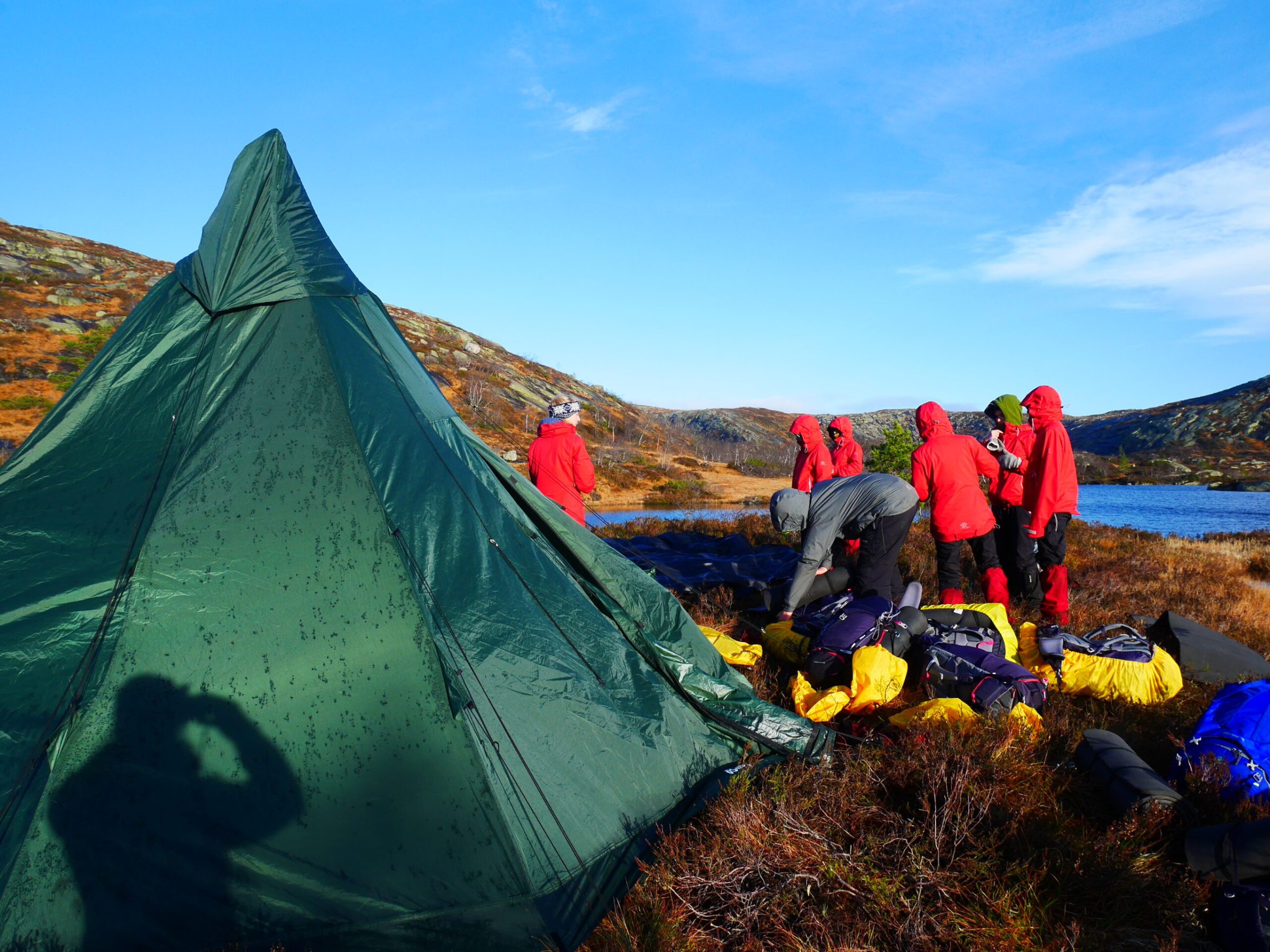 a man sitting on top of a mountain
